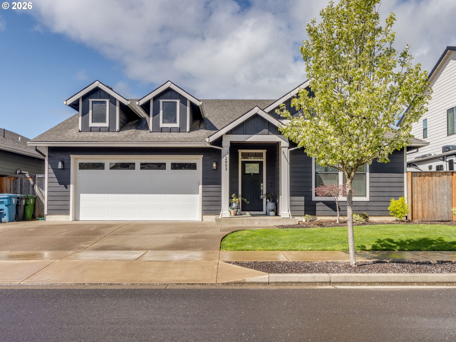 2893 4th Street Hubbard, OR 97032 - Photo 32 of 41 a front view of a house with a yard