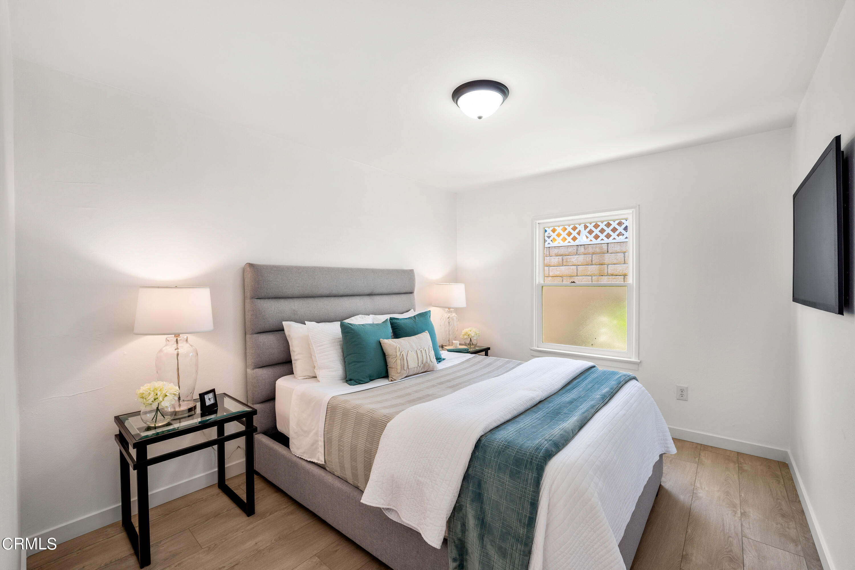 3652 Ocean Drive Oxnard, CA 93035 - Photo 17 of 28 a bedroom with a bed and a tv