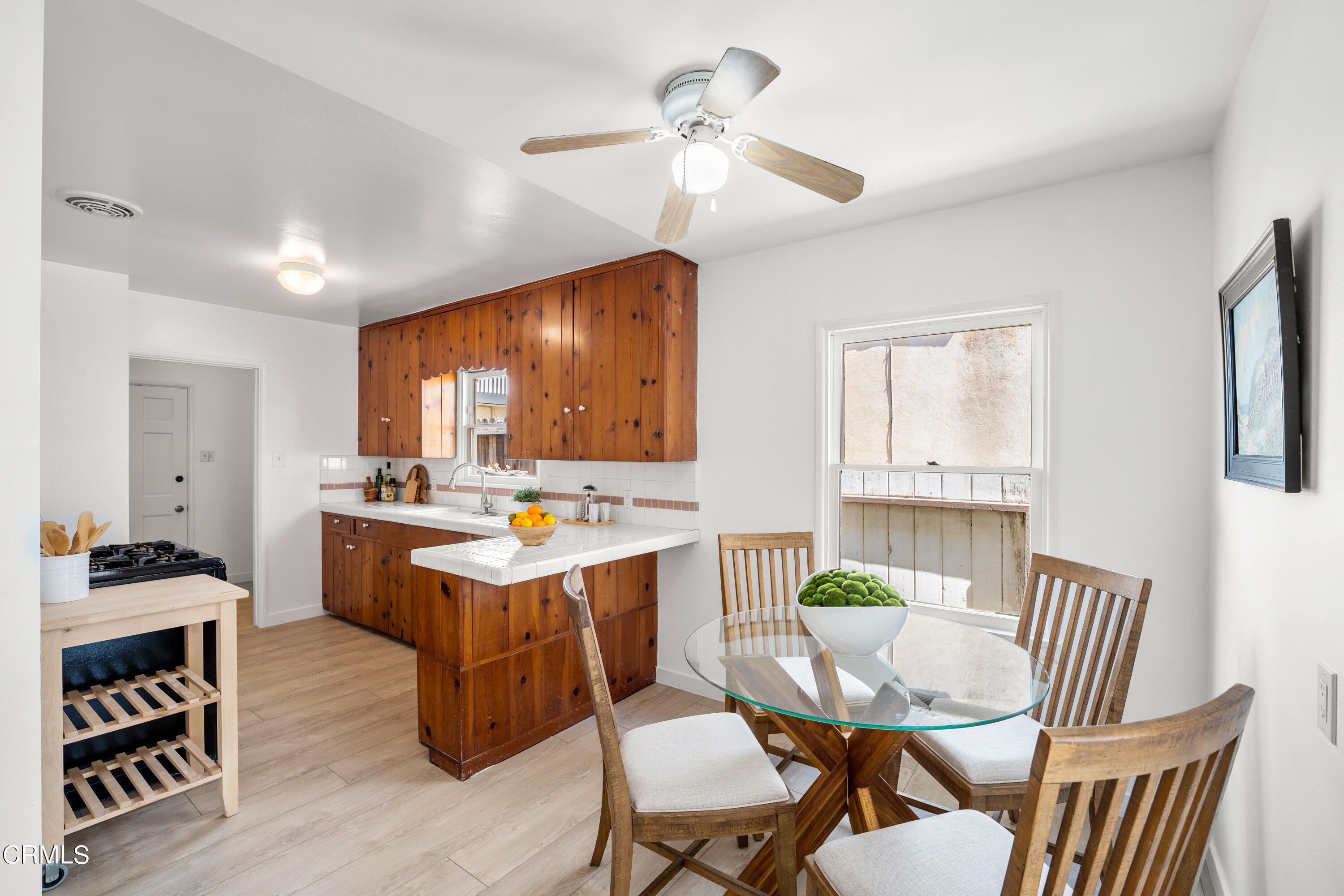 3652 Ocean Drive Oxnard, CA 93035 - Photo 3 of 28 a view of a dining room with furniture window and wooden floor