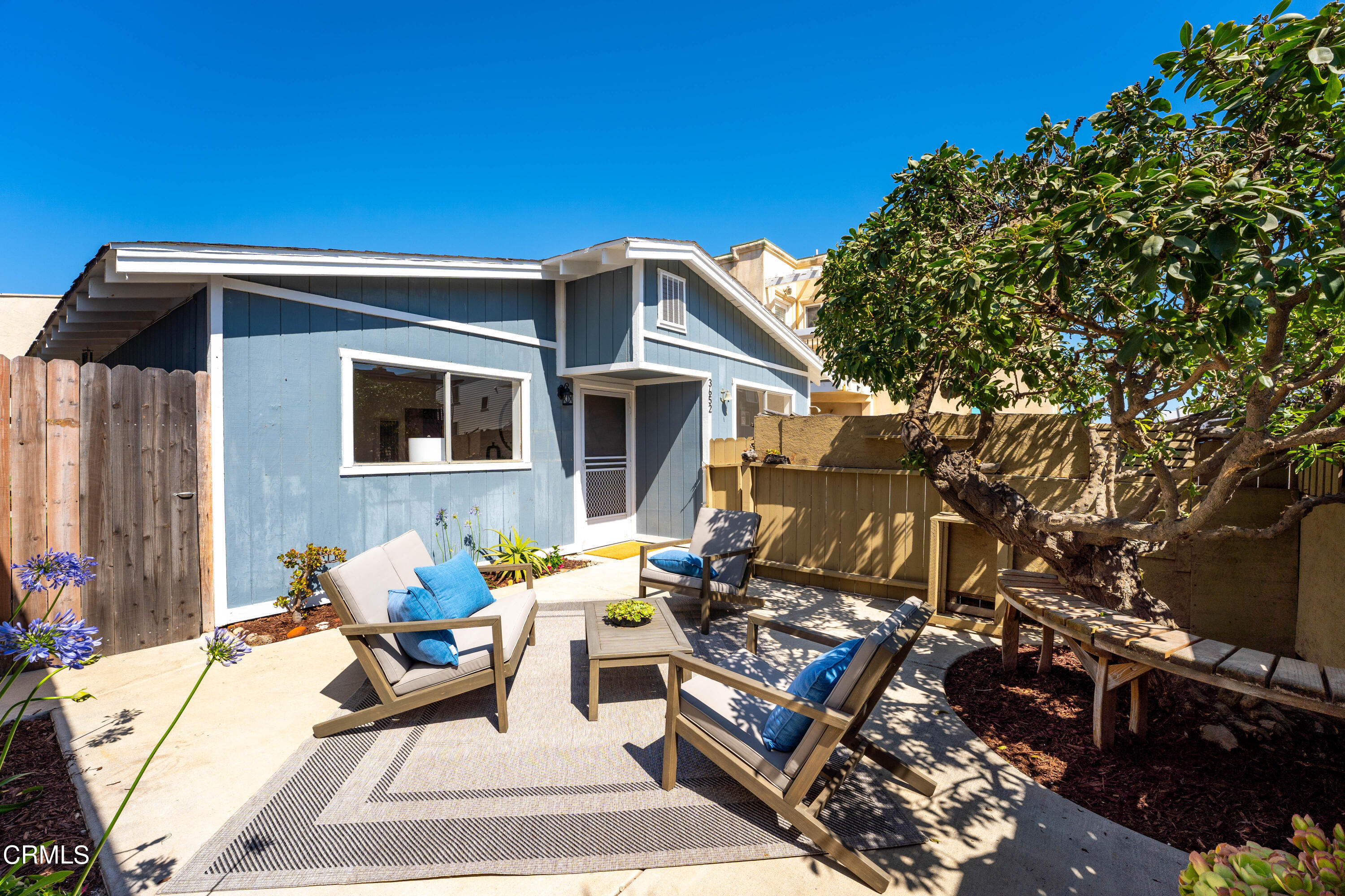 3652 Ocean Drive Oxnard, CA 93035 - Photo 5 of 28 a patio with table and chairs and potted plants