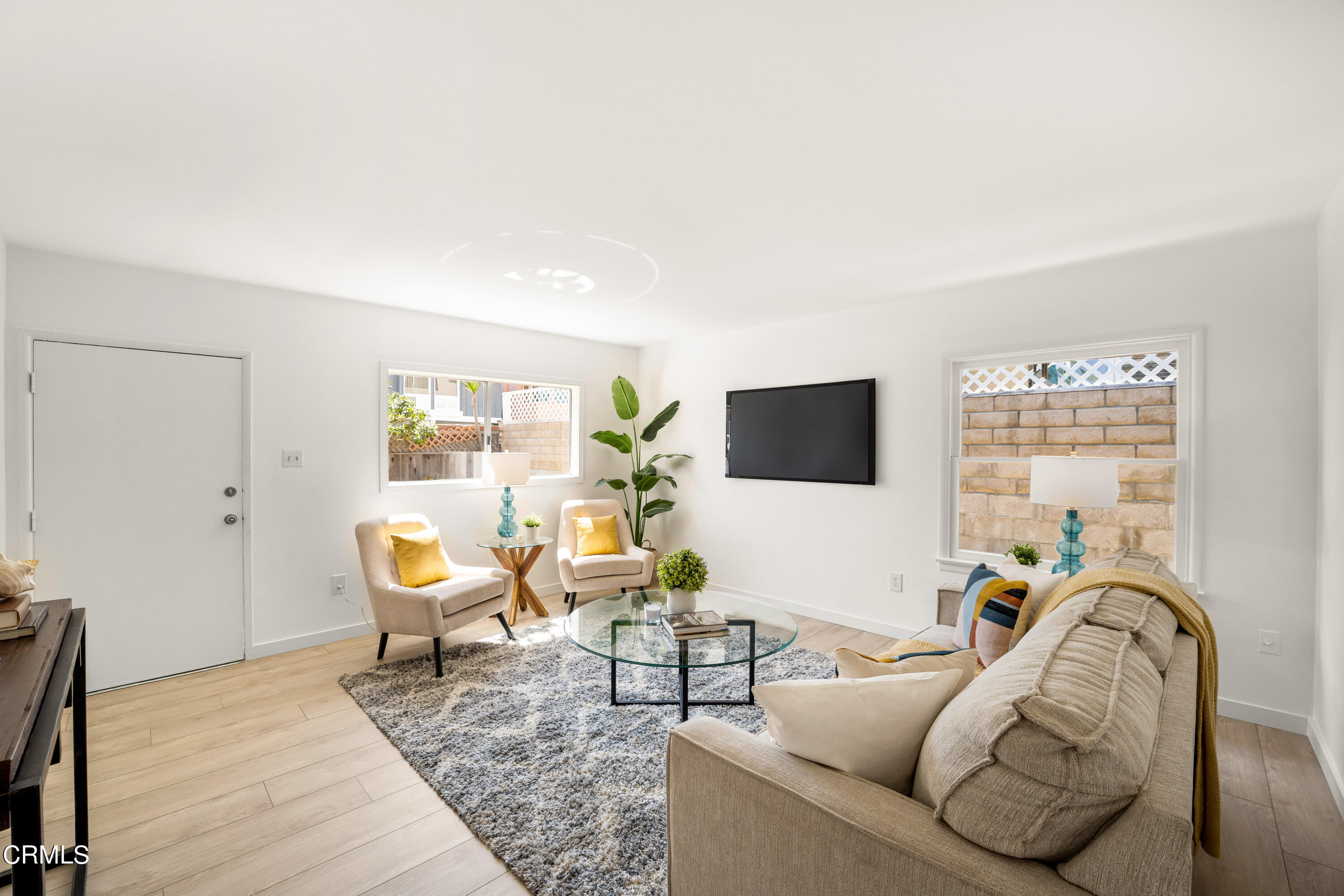 3652 Ocean Drive Oxnard, CA 93035 - Photo 7 of 28 a living room with furniture and a flat screen tv