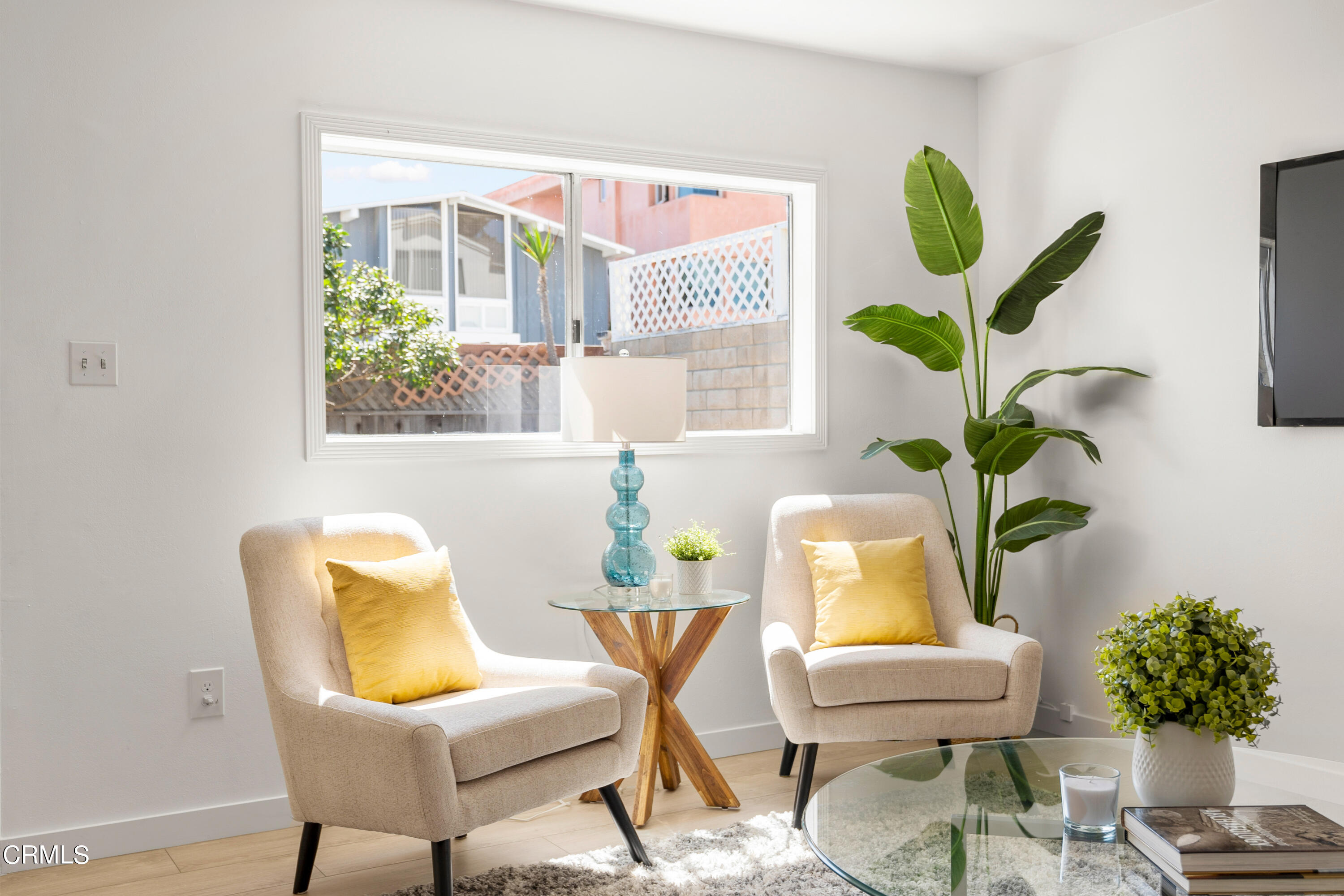 3652 Ocean Drive Oxnard, CA 93035 - Photo 8 of 28 a dining room with furniture and a potted plant