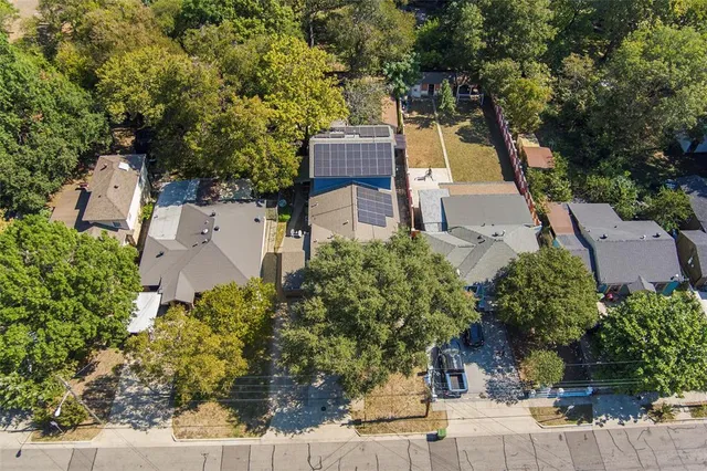 an aerial view of a house with a garden