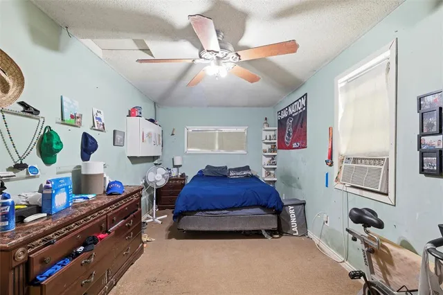 a bedroom with furniture and a window
