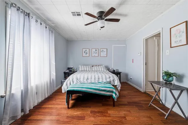 a bed sitting in a room next to a window