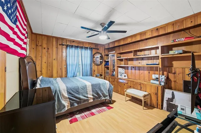a bed room with a bed and a book shelf