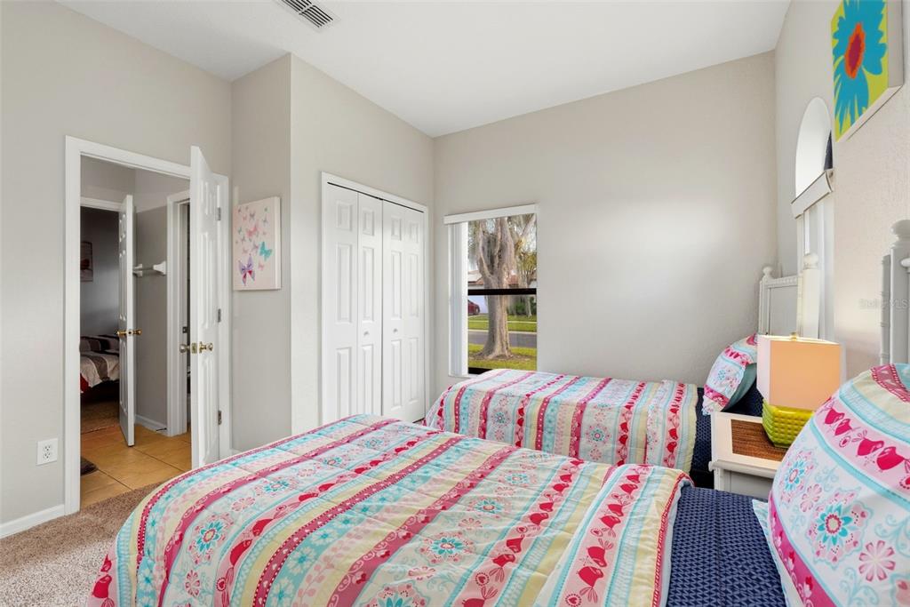 16602 Lazy Breeze Loop Clermont, FL 34714 - Photo 29 of 51 a bedroom with a bed and a window