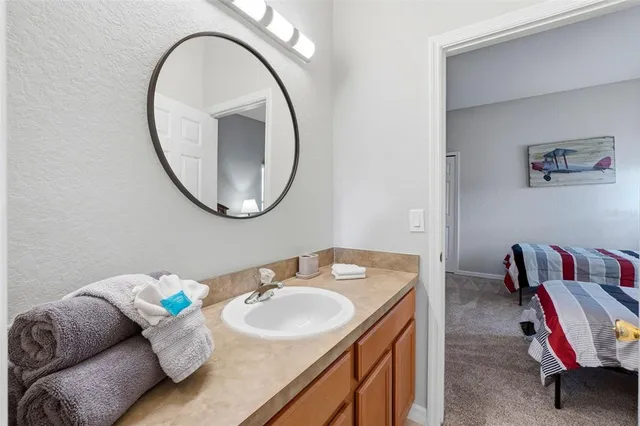 a bathroom with a sink and a mirror