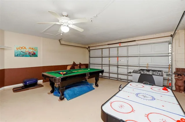 a bedroom with furniture and a fan