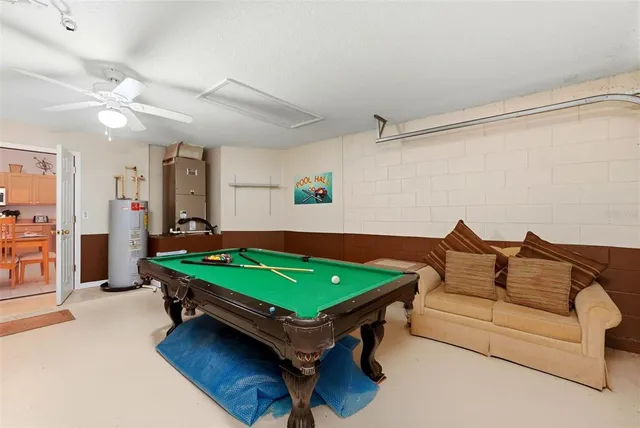 a room with furniture and pool table