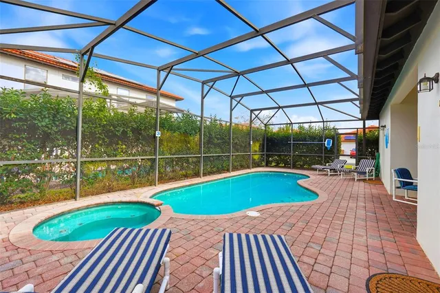a view of a swimming pool with a patio