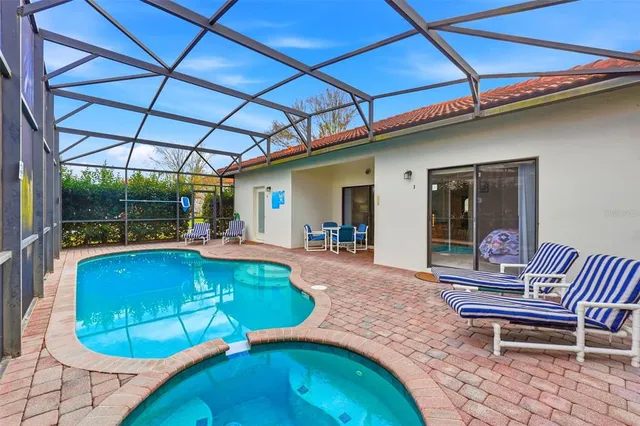 a view of a swimming pool with an outdoor seating
