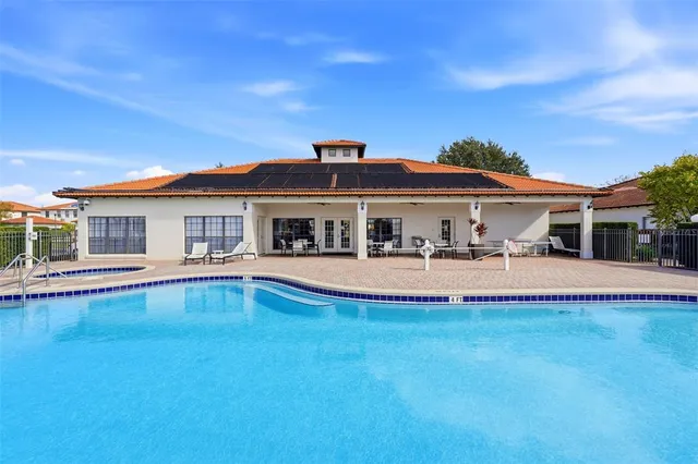 a view of a patio with swimming pool