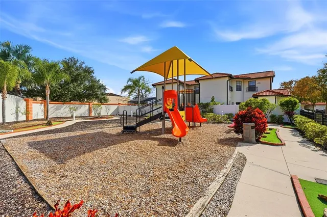 swimming pool view with a garden