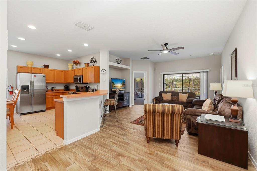 16602 Lazy Breeze Loop Clermont, FL 34714 - Photo 7 of 51 a living room with furniture and kitchen view