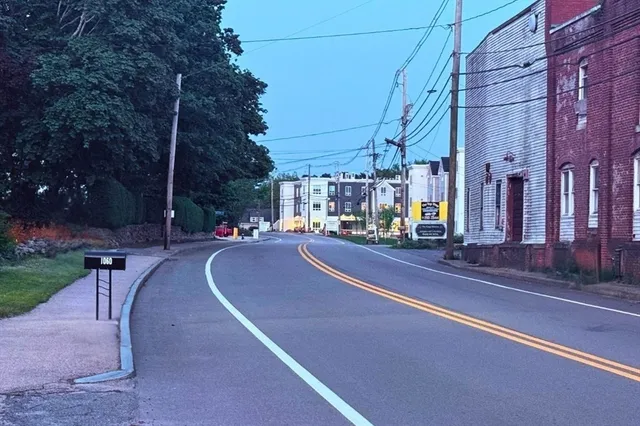 a view of a city street lined with tall buildings
