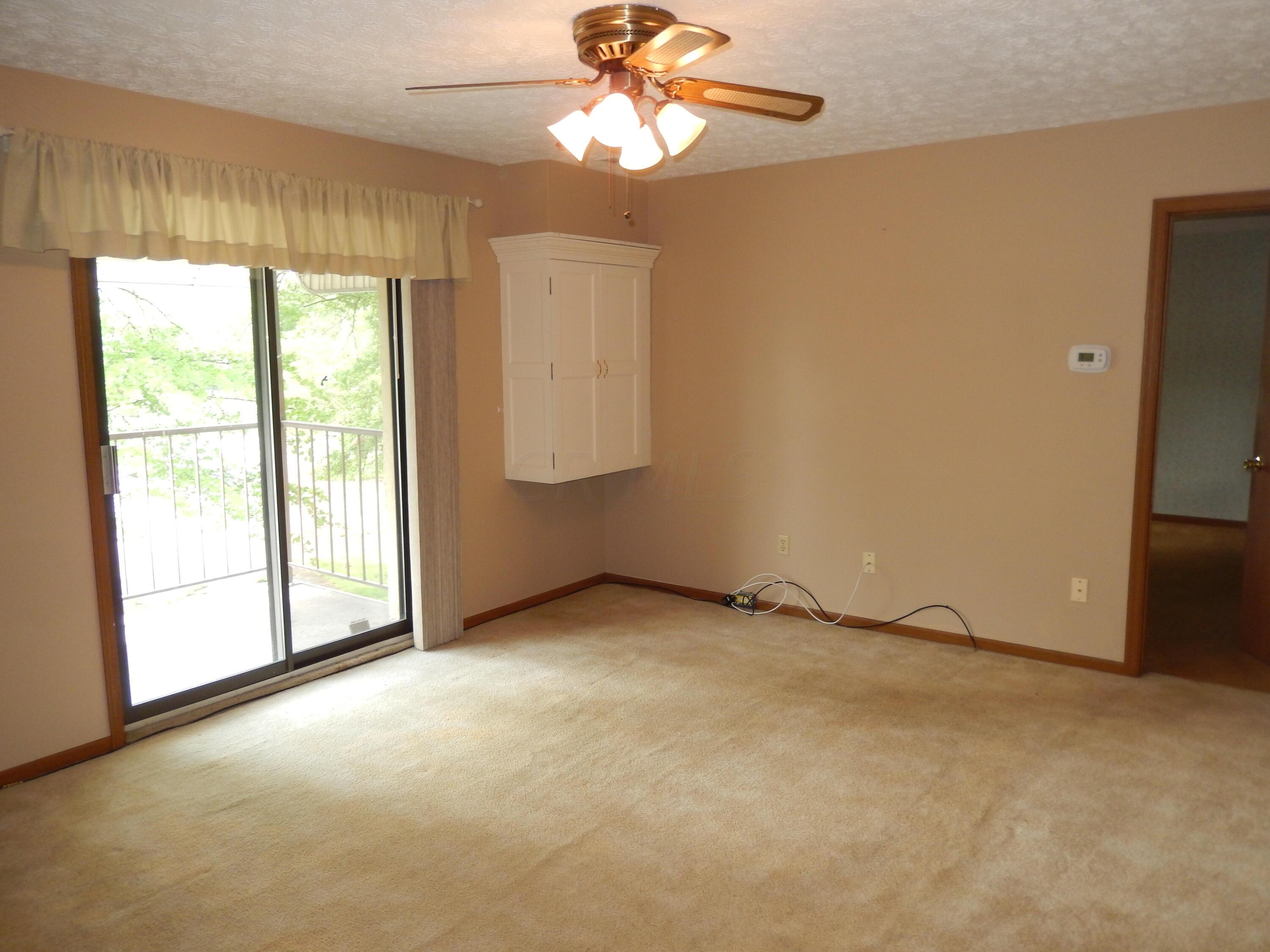 4119 Karl Road, Unit 309 Columbus, OH 43224 - Photo 14 of 26 Living Room Area with Sliding Door to Covered Balcony