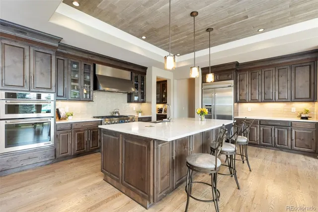 a kitchen with a sink cabinets and window