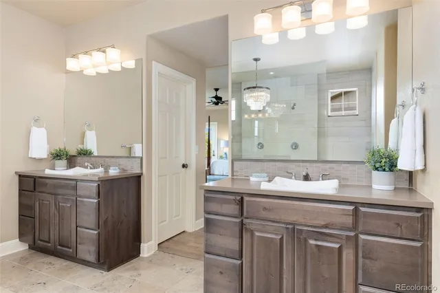 a bathroom with a sink double vanity and a mirror