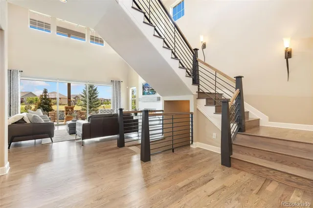 a view of entryway and hall with wooden floor
