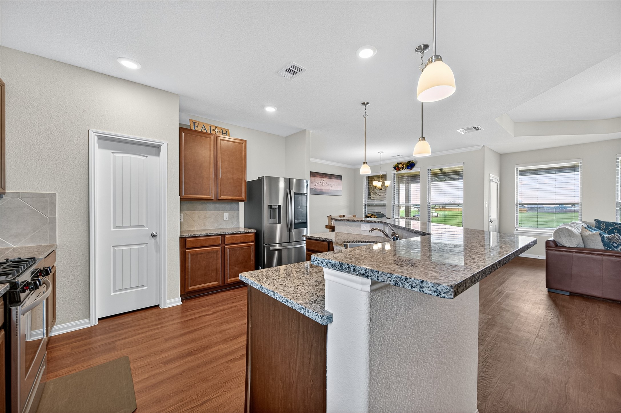 8007 Lehman Road Beasley, TX 77417 - Photo 12 of 47 a kitchen with stainless steel appliances granite countertop a sink refrigerator and cabinets