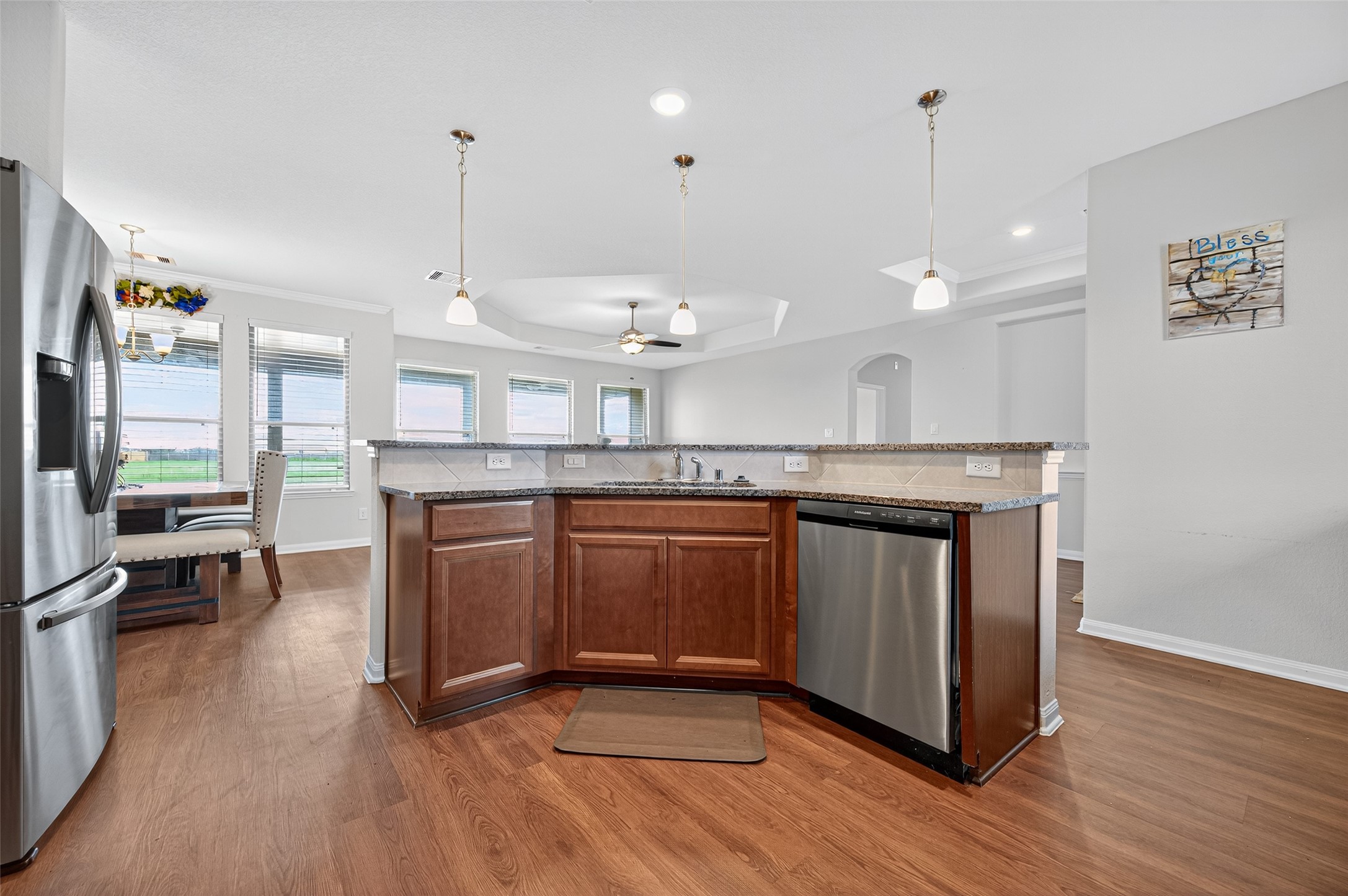 8007 Lehman Road Beasley, TX 77417 - Photo 13 of 47 a kitchen with stainless steel appliances granite countertop a sink a stove and a wooden floors
