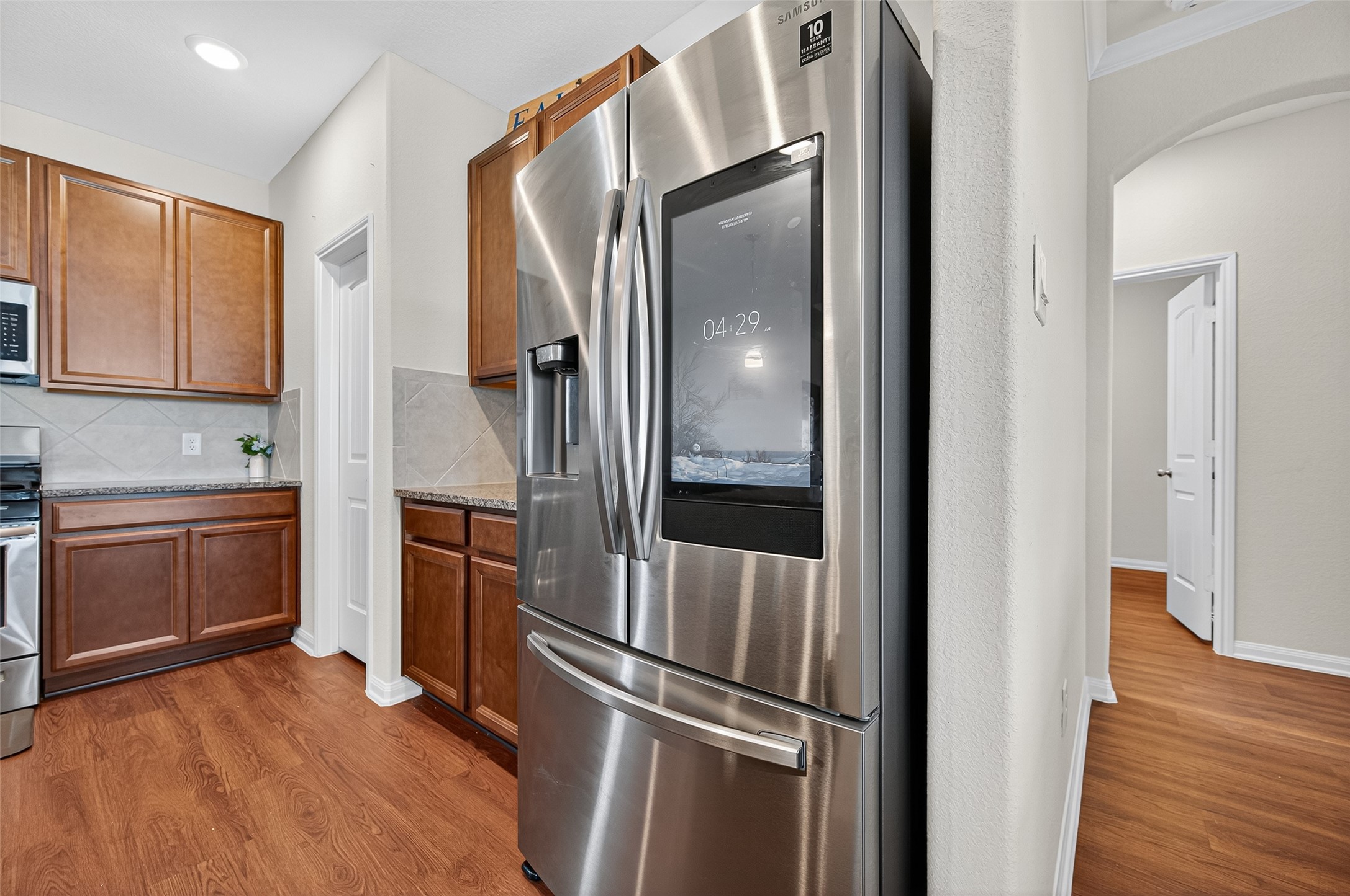 8007 Lehman Road Beasley, TX 77417 - Photo 17 of 47 a kitchen with a refrigerator and a stove top oven