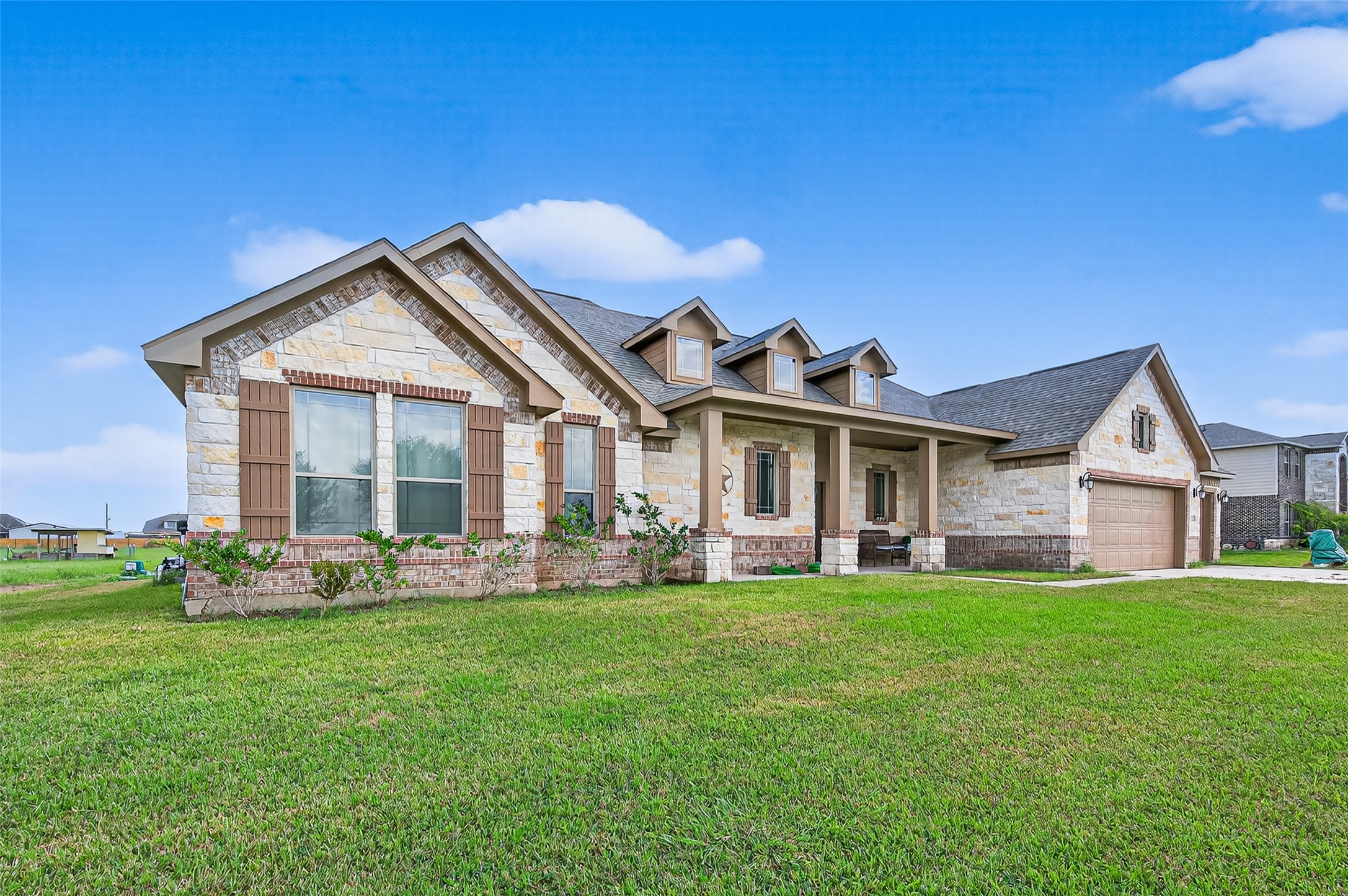 8007 Lehman Road Beasley, TX 77417 - Photo 2 of 47 a front view of a house with a garden and trees