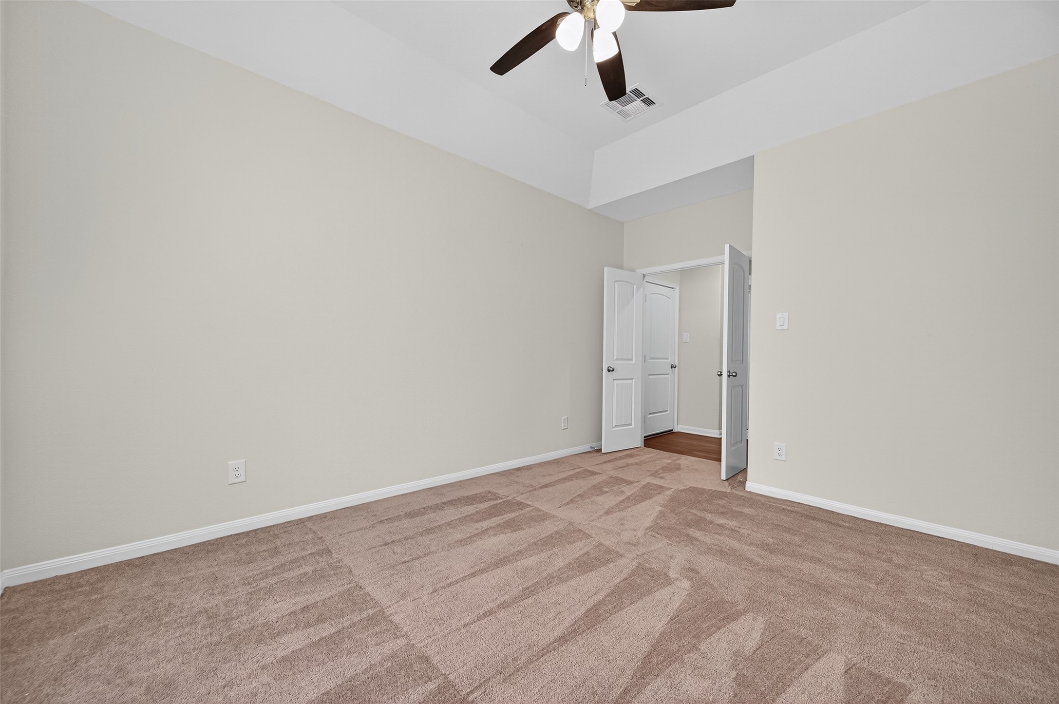 8007 Lehman Road Beasley, TX 77417 - Photo 28 of 47 an empty room with a ceiling fan and carpet