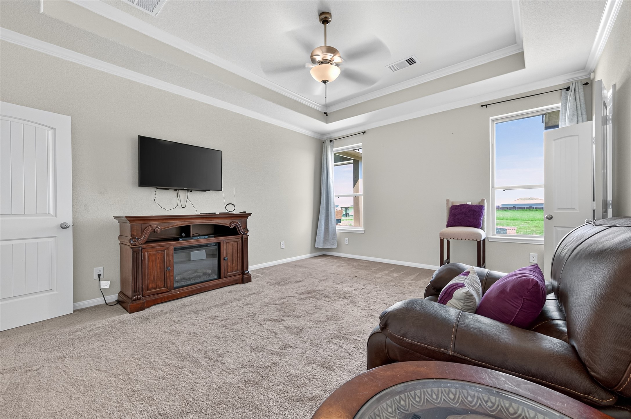 8007 Lehman Road Beasley, TX 77417 - Photo 30 of 47 a living room with furniture a fireplace and a flat screen tv