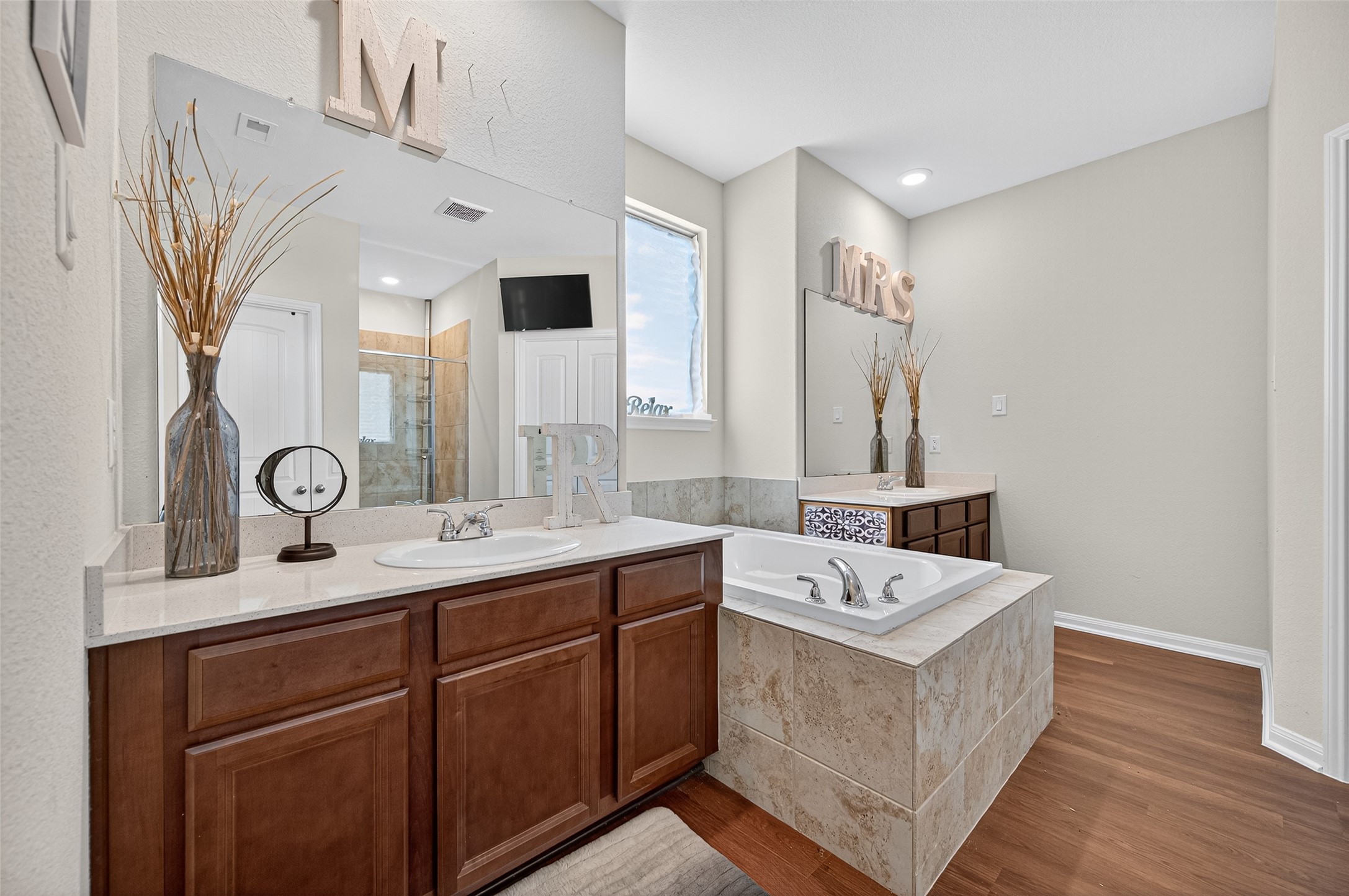 8007 Lehman Road Beasley, TX 77417 - Photo 34 of 47 a bathroom with a sink double vanity granite and a mirror