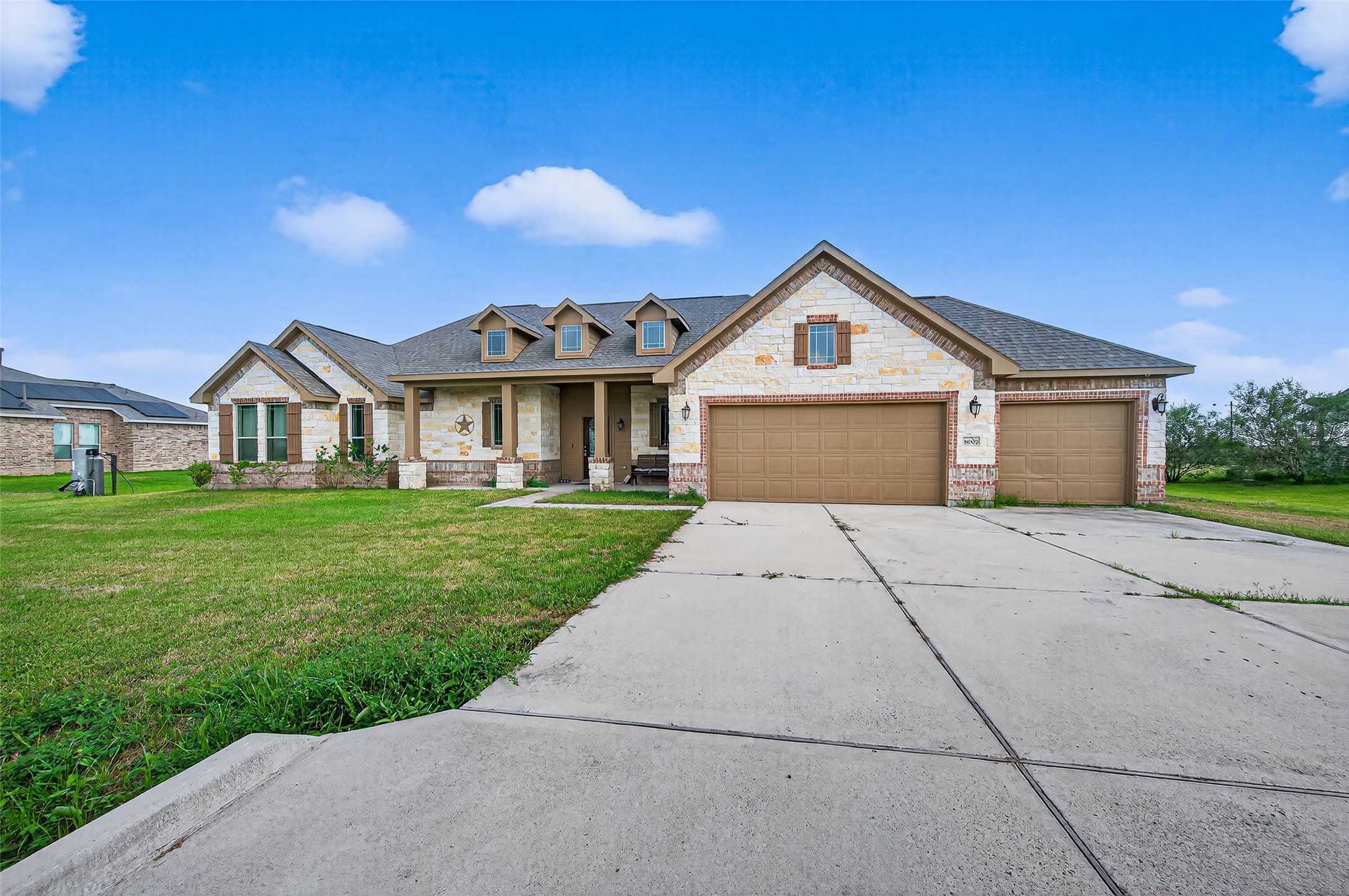 8007 Lehman Road Beasley, TX 77417 - Photo 4 of 47 a front view of a house with a yard and garage
