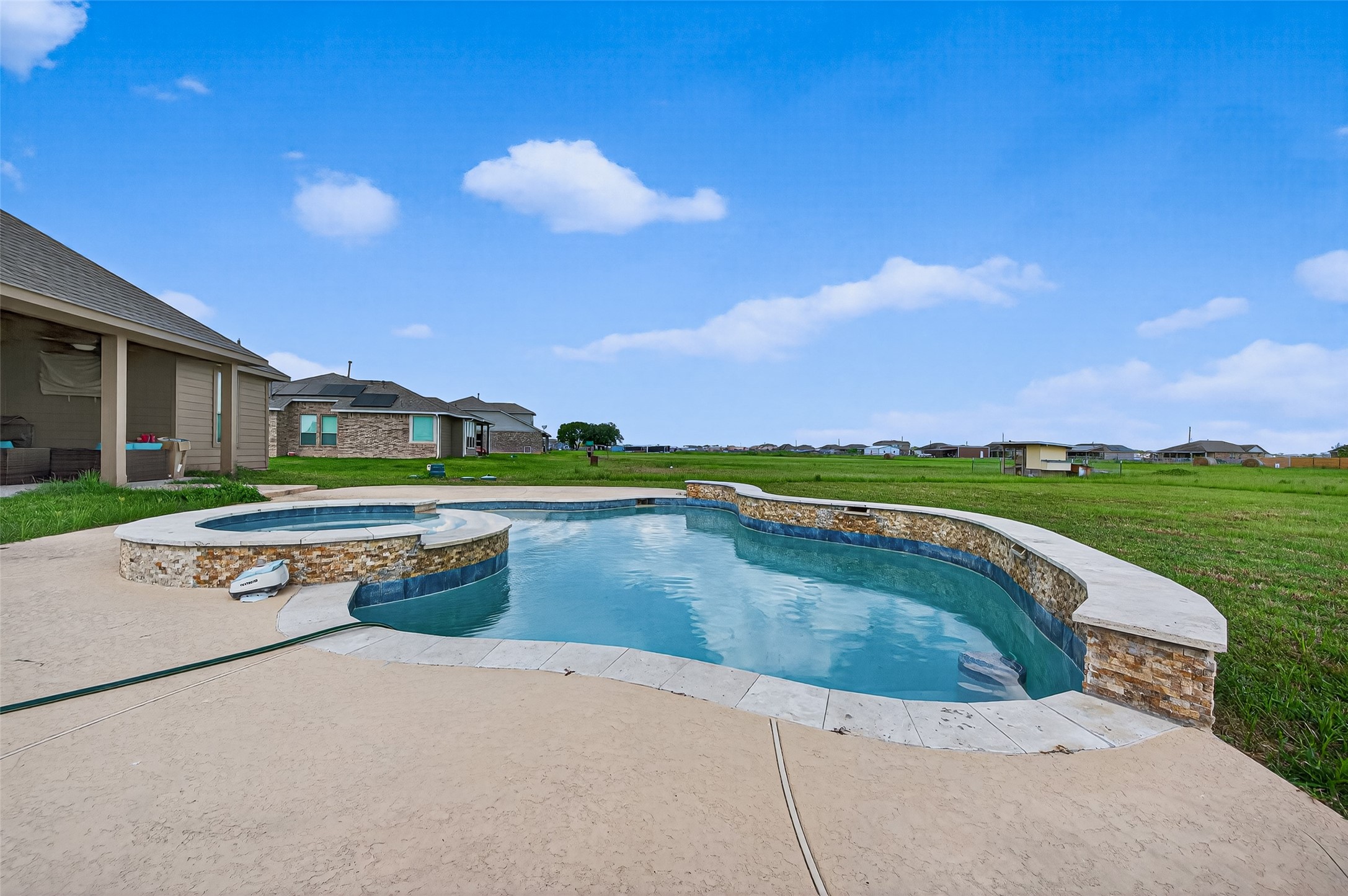 8007 Lehman Road Beasley, TX 77417 - Photo 44 of 47 a view of a swimming pool with a lounge chairs