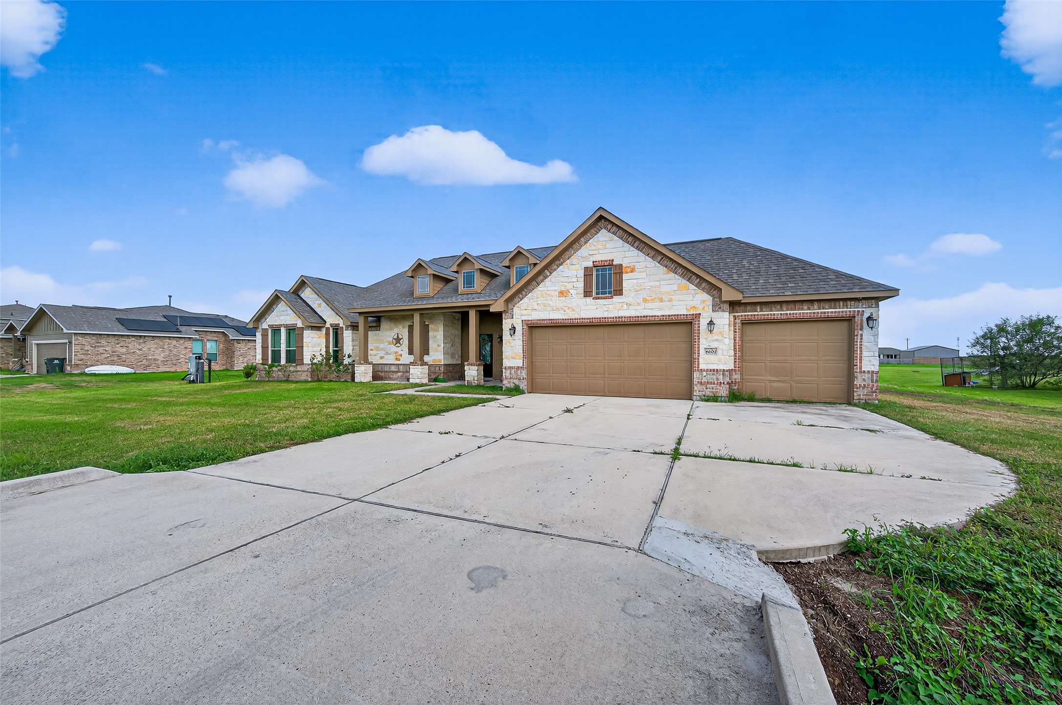 8007 Lehman Road Beasley, TX 77417 - Photo 5 of 47 a front view of a house with a yard and garage