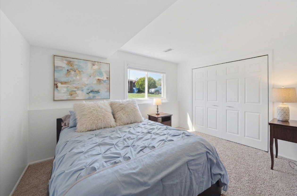 3517 Jacqueline Drive Crete, IL 60417 - Photo 11 of 26 a bedroom with a large bed and a window