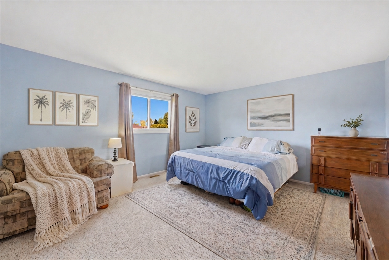 3517 Jacqueline Drive Crete, IL 60417 - Photo 13 of 26 a spacious bedroom with a bed and a couch