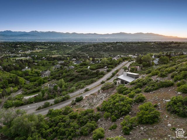 10471 Wasatch Boulevard Sandy, UT 84092 - Photo 6 of 10 Drone / aerial view of mountains and a tree filled landscape