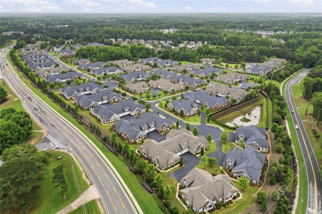3328 Ivy Ridge Court Buford, GA 30519 - Photo 31 of 34 an aerial view of residential houses with outdoor space