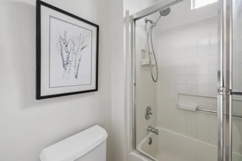 a bathroom with a bathtub and a shower