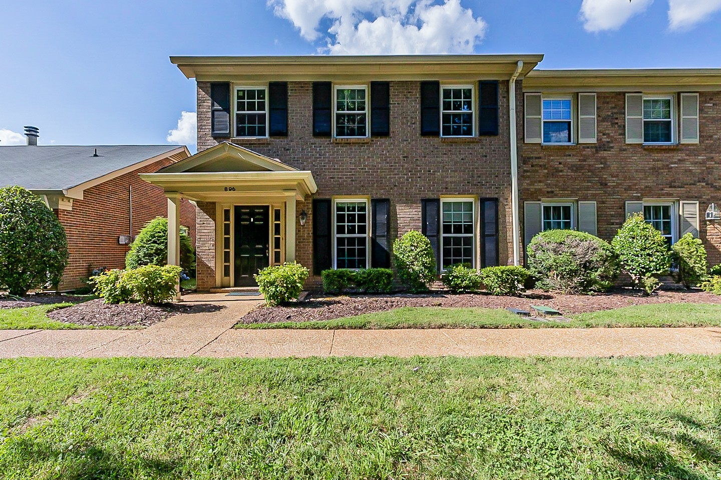 896 General George Patton Road Nashville, TN 37221 - Photo 1 of 23 a front view of a house with a yard