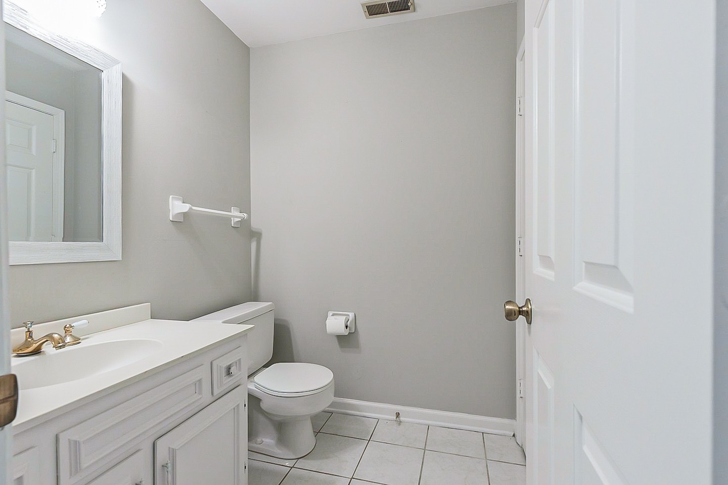 896 General George Patton Road Nashville, TN 37221 - Photo 11 of 23 a white toilet sitting next to a bathroom sink