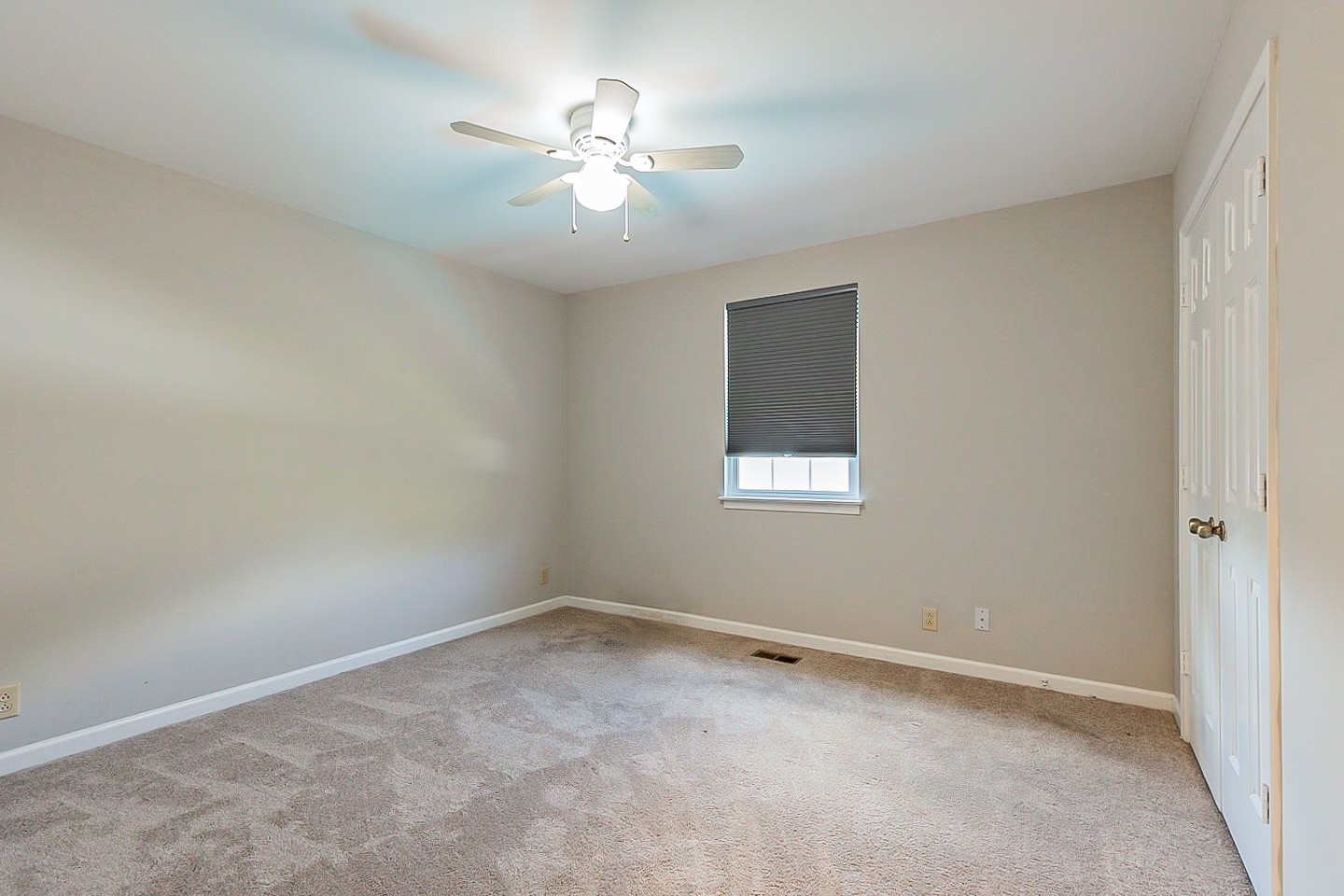 896 General George Patton Road Nashville, TN 37221 - Photo 17 of 23 an empty room with a chandelier fan and windows
