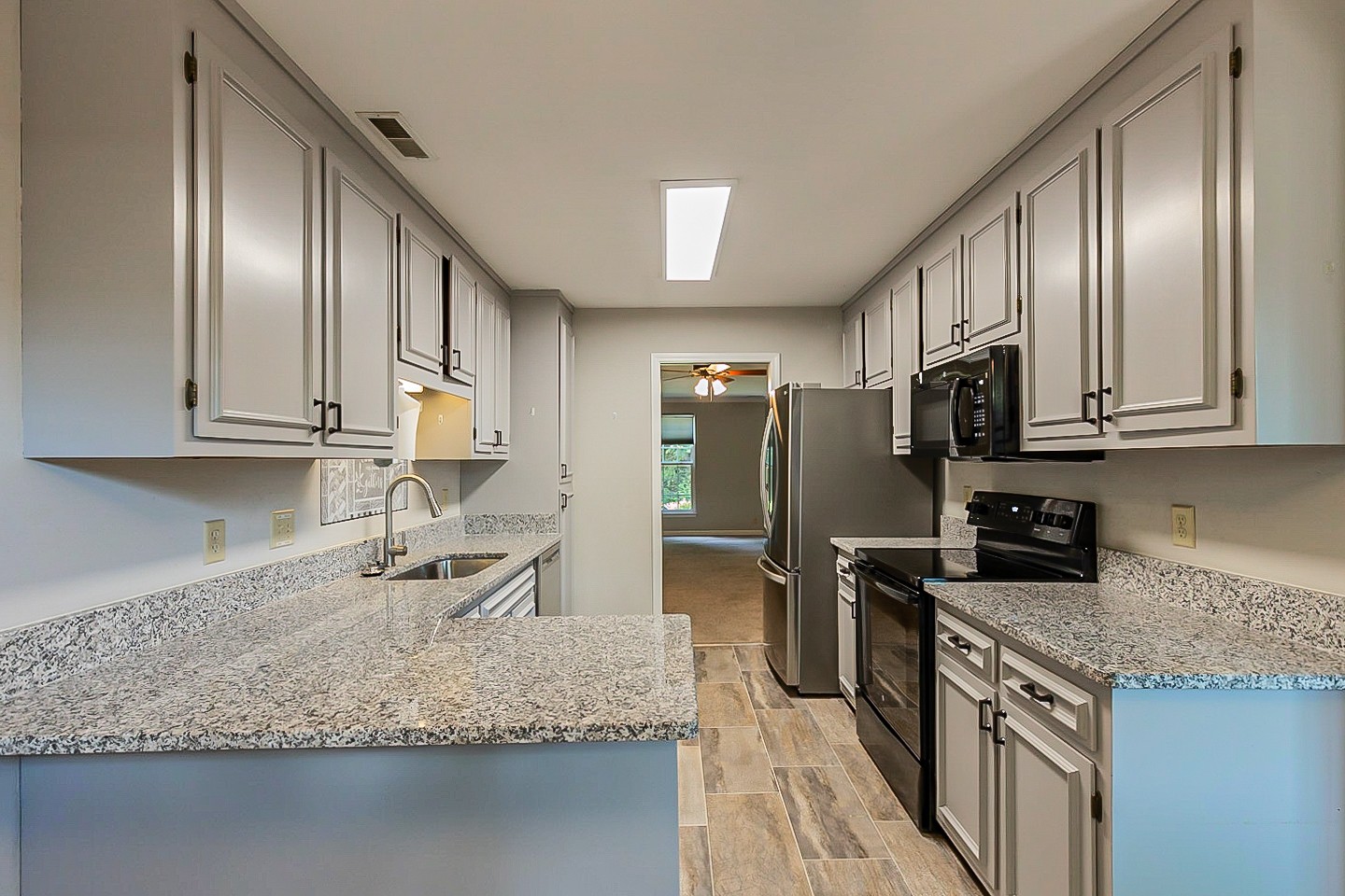 896 General George Patton Road Nashville, TN 37221 - Photo 4 of 23 a kitchen with stainless steel appliances granite countertop a sink stove and refrigerator