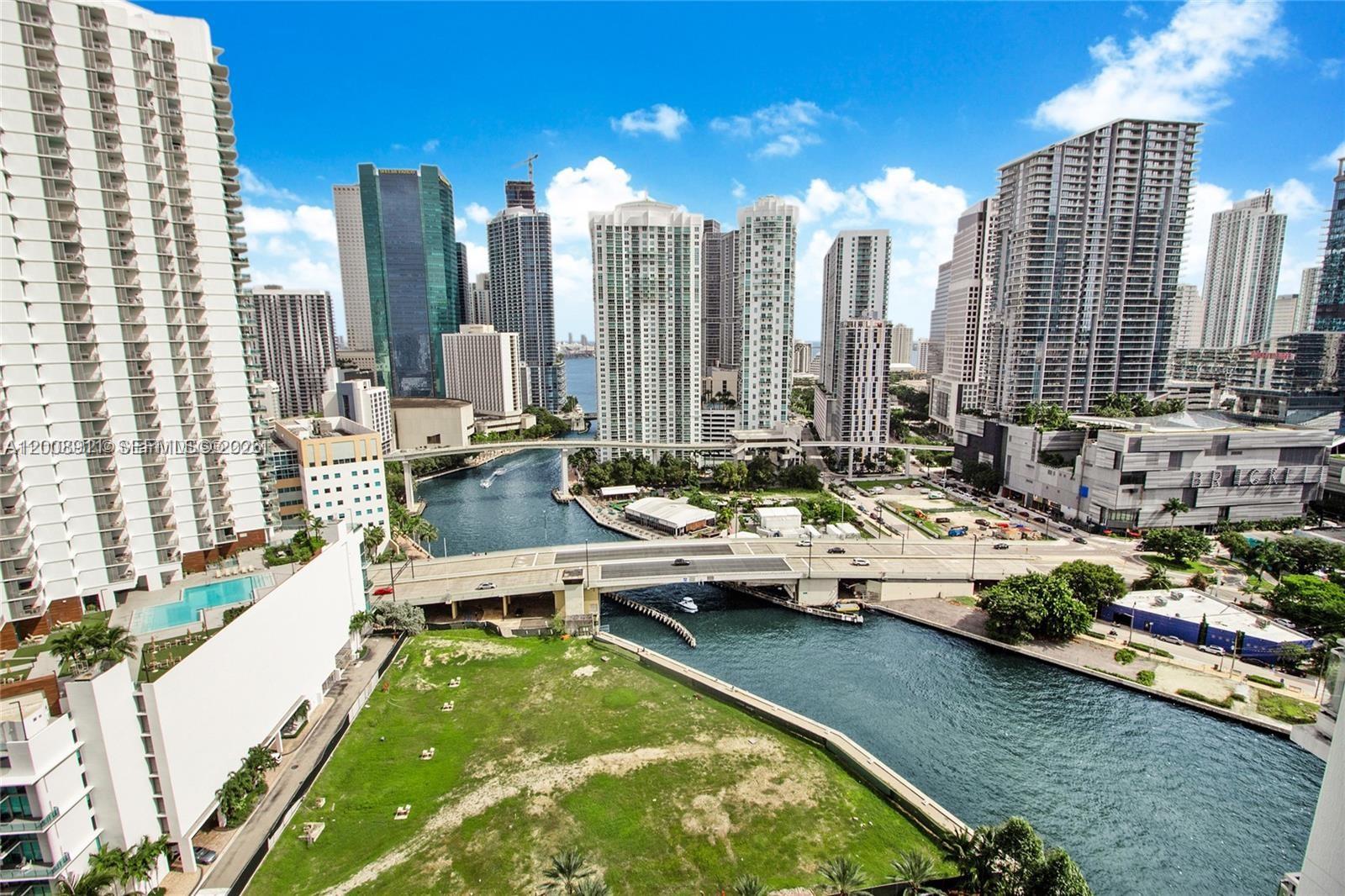 92 Southwest 3rd Street, Unit 2510 Miami, FL 33130 - Photo 1 of 35 a view of swimming pool with outdoor seating
