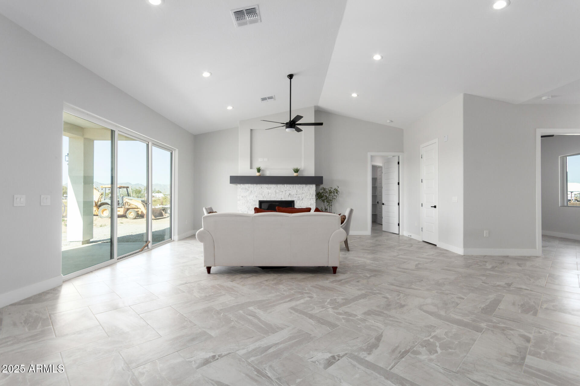 19657 West Dunlap Road Buckeye, AZ 85326 - Photo 14 of 45 a large kitchen with stainless steel appliances a large counter top a stove and a refrigerator