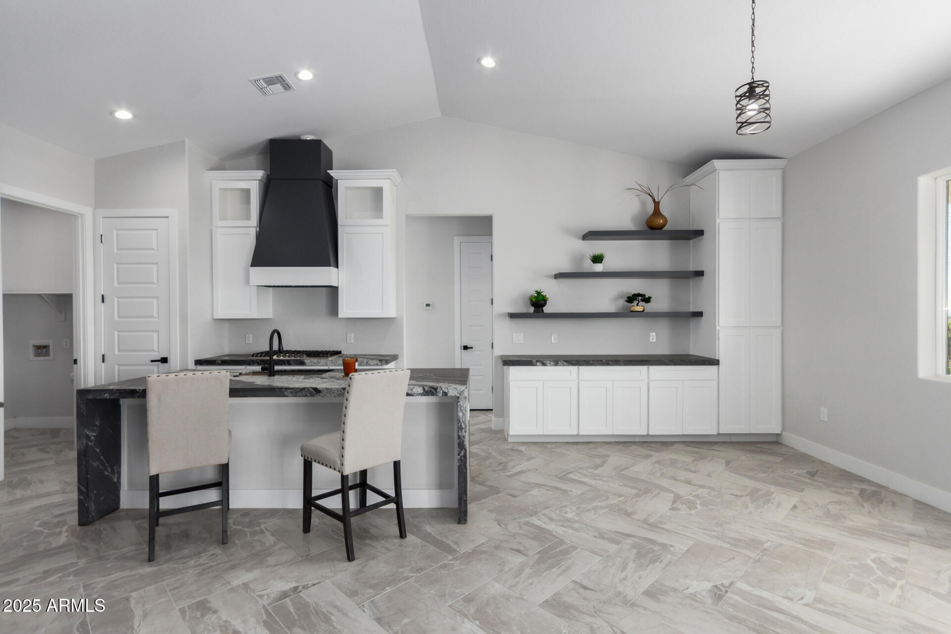 19657 West Dunlap Road Buckeye, AZ 85326 - Photo 15 of 45 a kitchen with stainless steel appliances a stove a sink cabinets and a refrigerator