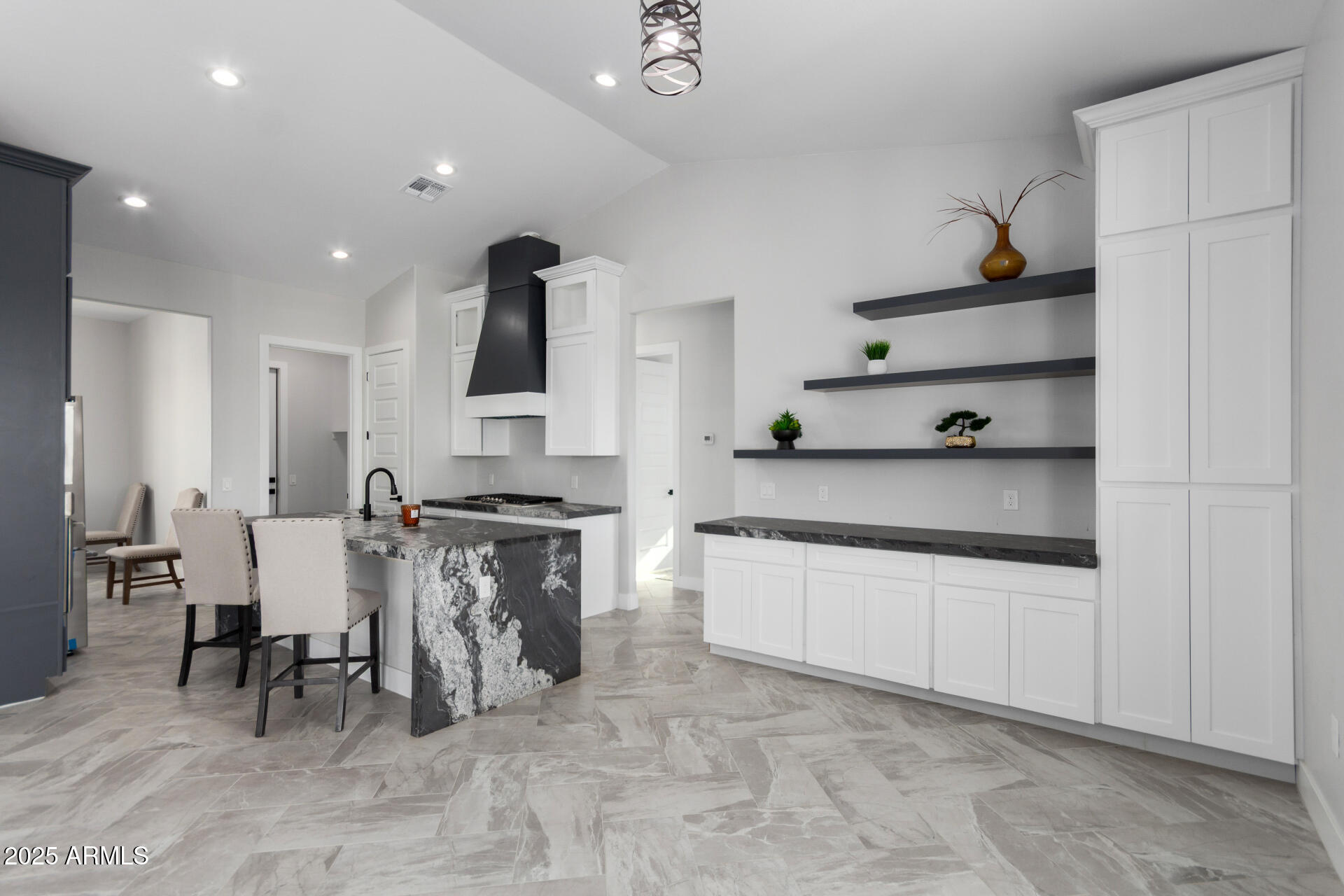 19657 West Dunlap Road Buckeye, AZ 85326 - Photo 16 of 45 a living room with stainless steel appliances kitchen island granite countertop furniture and a view of living room