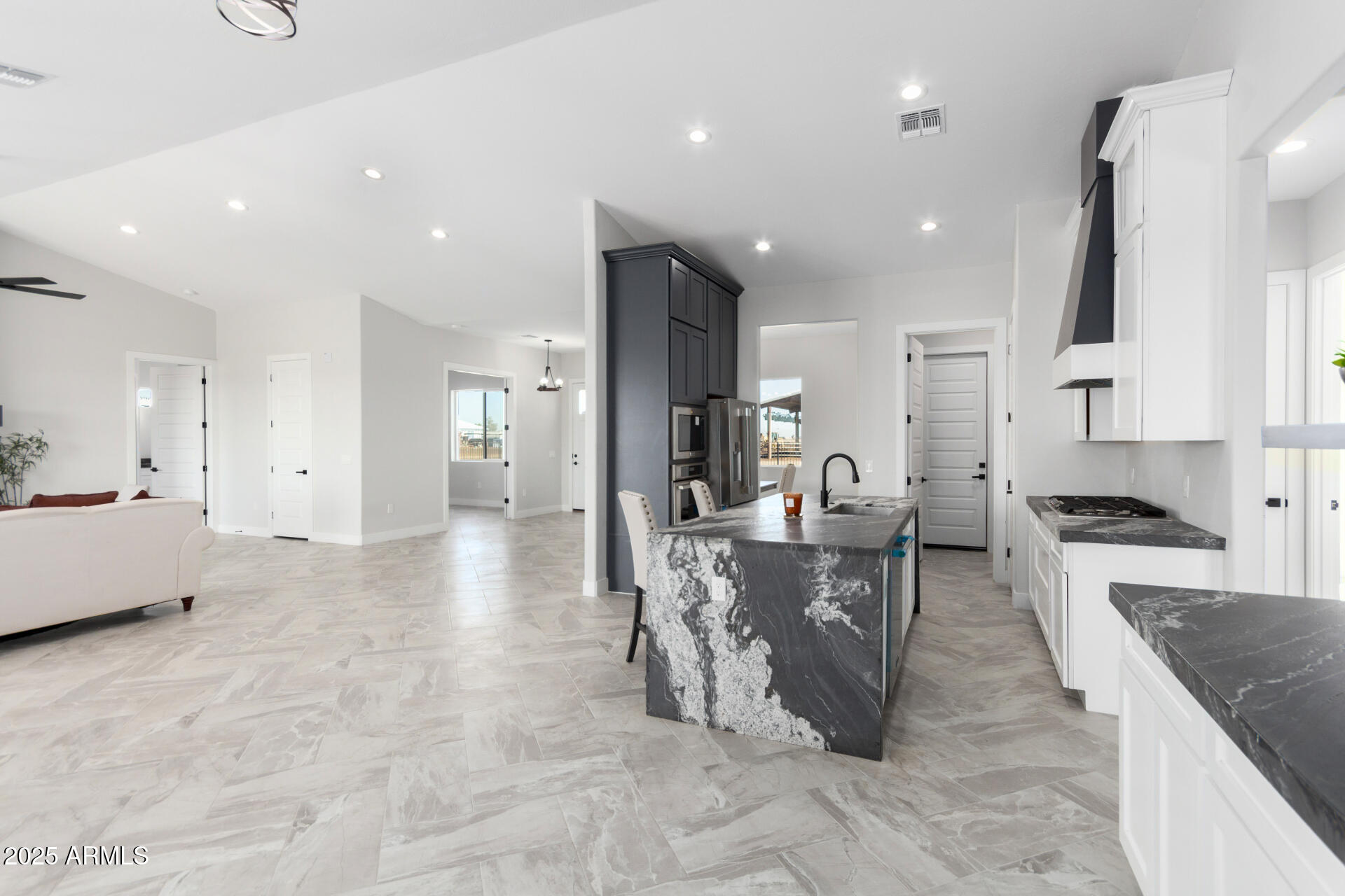 19657 West Dunlap Road Buckeye, AZ 85326 - Photo 17 of 45 a large kitchen with stainless steel appliances lots of counter top space