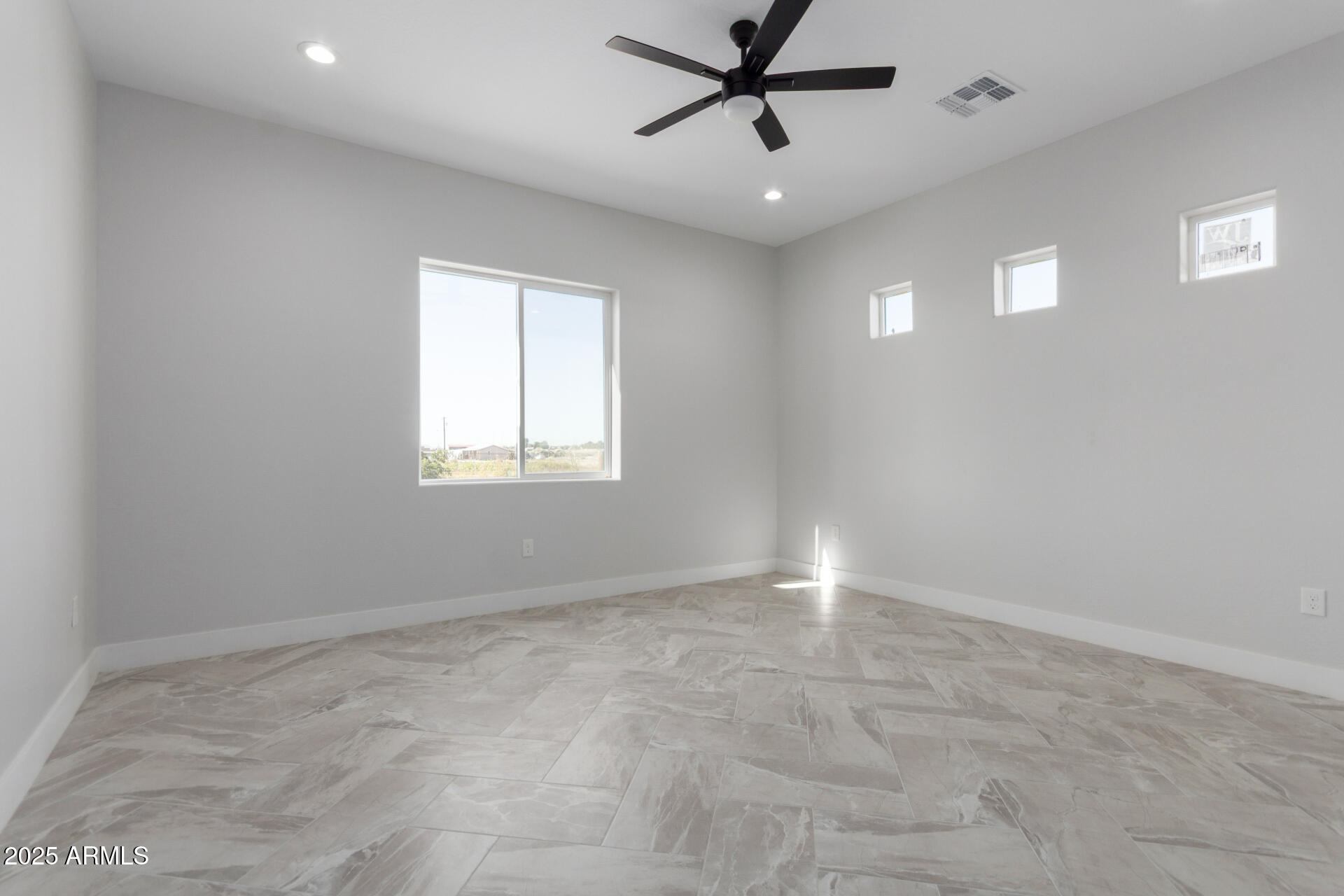 19657 West Dunlap Road Buckeye, AZ 85326 - Photo 24 of 45 a view of an empty room with a window