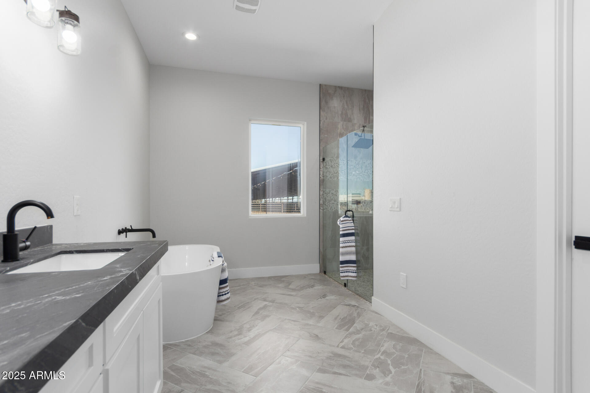 19657 West Dunlap Road Buckeye, AZ 85326 - Photo 28 of 45 a bathroom with a sink and mirror